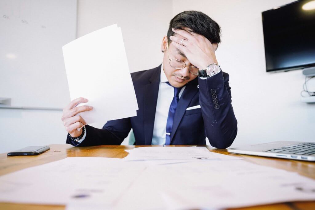 Duy in suit in office